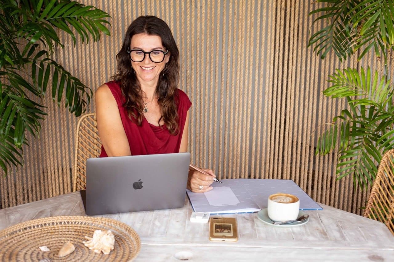 Dr. Jyoti Schonfelder working at her laptop